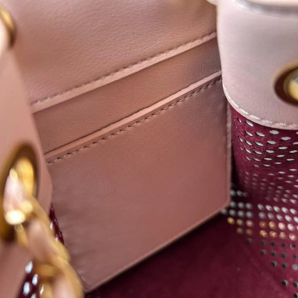 Light Pink Perforated Drawstring Bucket Bag, Interwoven Gold Chain Strap Hollow Grid Cutout Leather Crossbody Purse.