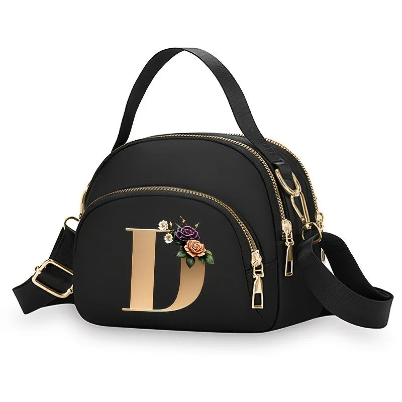 A fashionable women's messenger bag featuring a beautiful floral pattern with 26 letters, multiple compartments, and a large cap