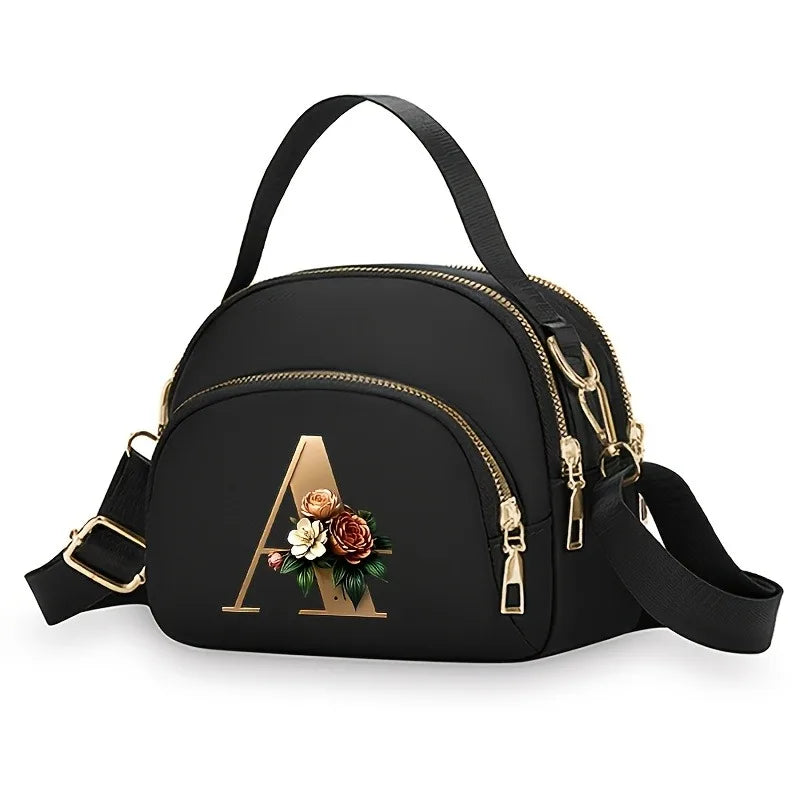 A fashionable women's messenger bag featuring a beautiful floral pattern with 26 letters, multiple compartments, and a large cap