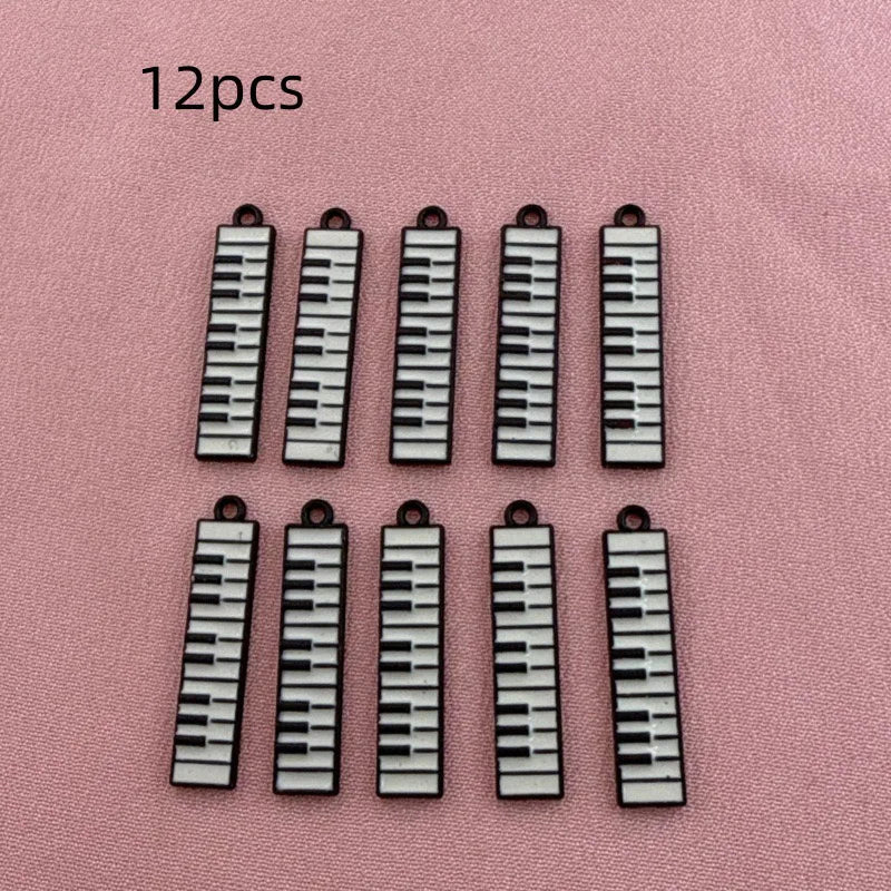12pcs black and white minimalist alloy drip oil jewelry accessories, piano keyboard keychain, cartoon fashion earrings, hanging