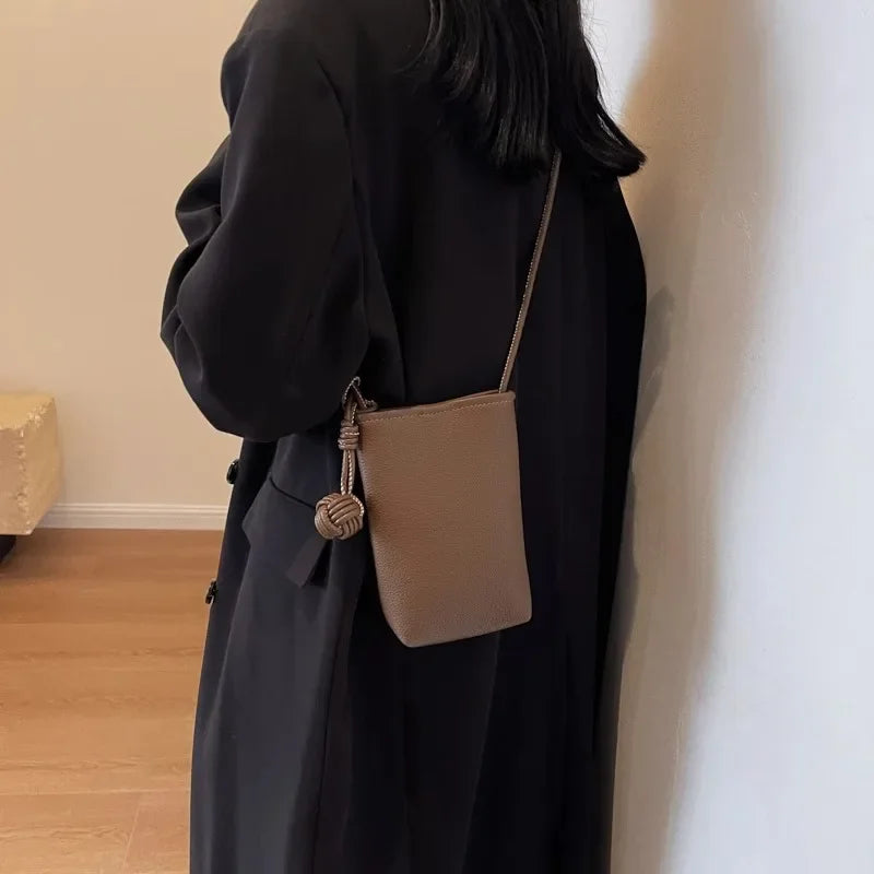 Versatile artistic small fresh small round ball pendant crossbody phone bag, soft leather cute mini bag for women