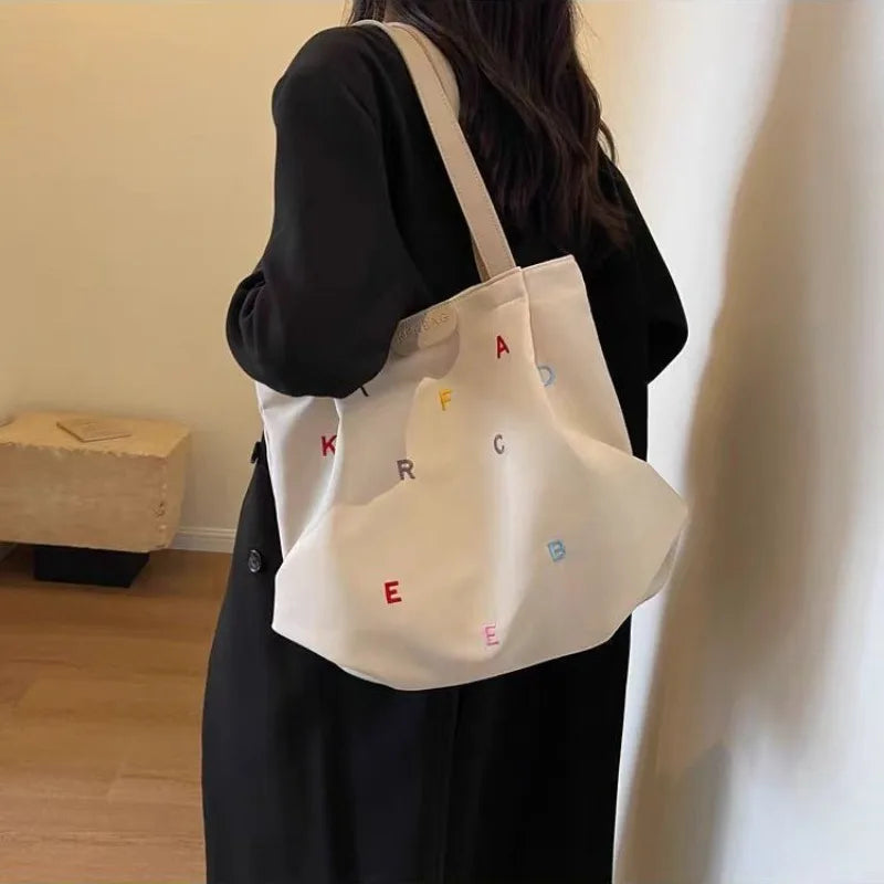 2025 New Canvas Bag Large Capacity Women's Trendy Embroidered Letter Tote Bag Small Fresh Student Shoulder Tote Bag