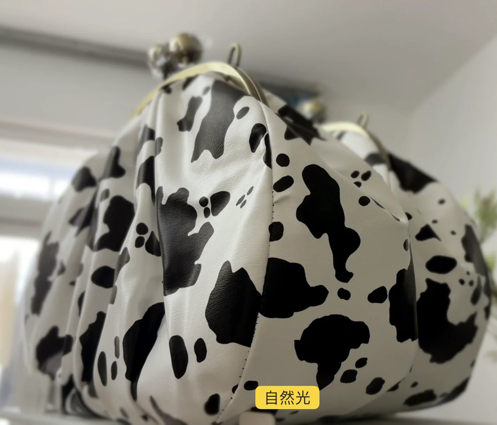 LOST IN VINTAGE Artficial Leather Cow Pattern Fabric Clutch Metal Frame Kiss Lock and Metal Handle Puffy Purse 34x23x11cm Cow