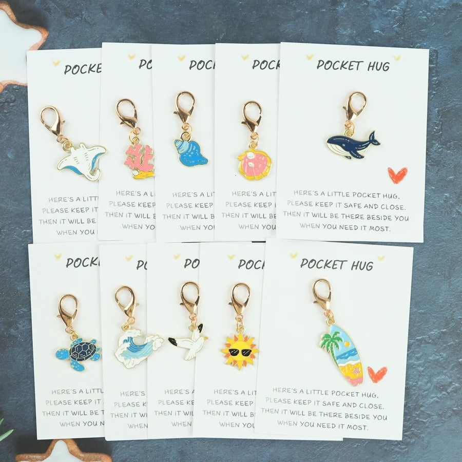 10 sea-themed keychain items featuring marine elements such as sea turtles, seagulls, whales, and shells. Includes a pocket-size