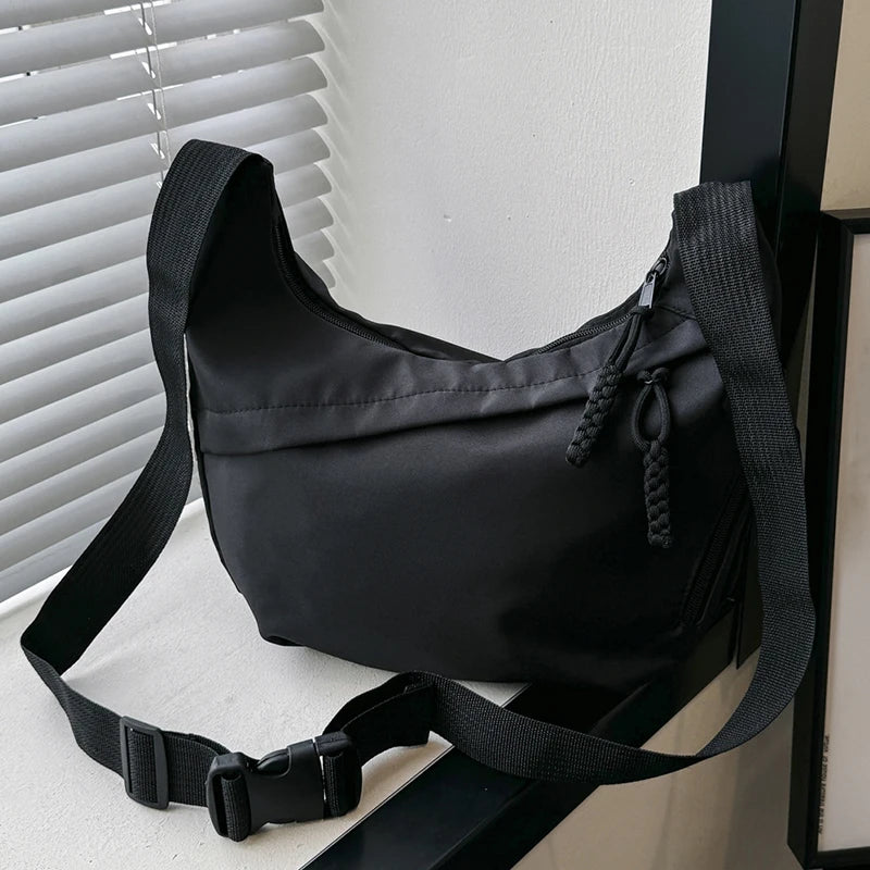 Neutral style tote bag with strap for carrying fitness items. New mini street-style handbag with shoulder strap. Lightweight and