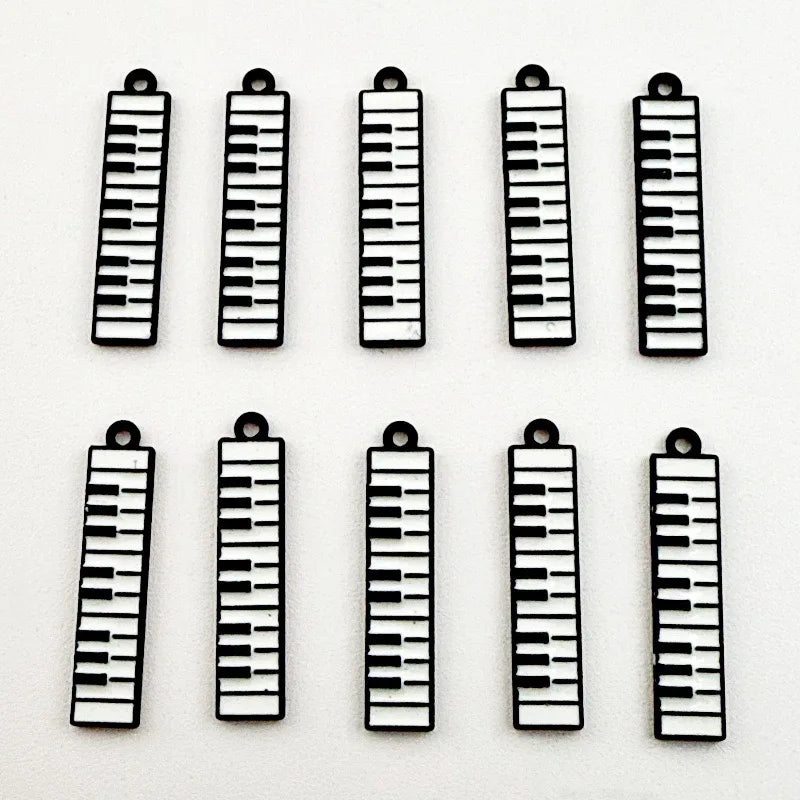 12pcs black and white minimalist alloy drip oil jewelry accessories, piano keyboard keychain, cartoon fashion earrings, hanging