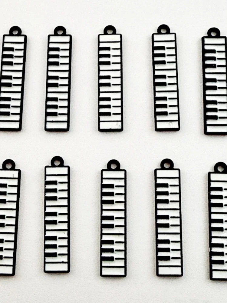 12pcs black and white minimalist alloy drip oil jewelry accessories, piano keyboard keychain, cartoon fashion earrings, hanging