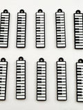 12pcs black and white minimalist alloy drip oil jewelry accessories, piano keyboard keychain, cartoon fashion earrings, hanging